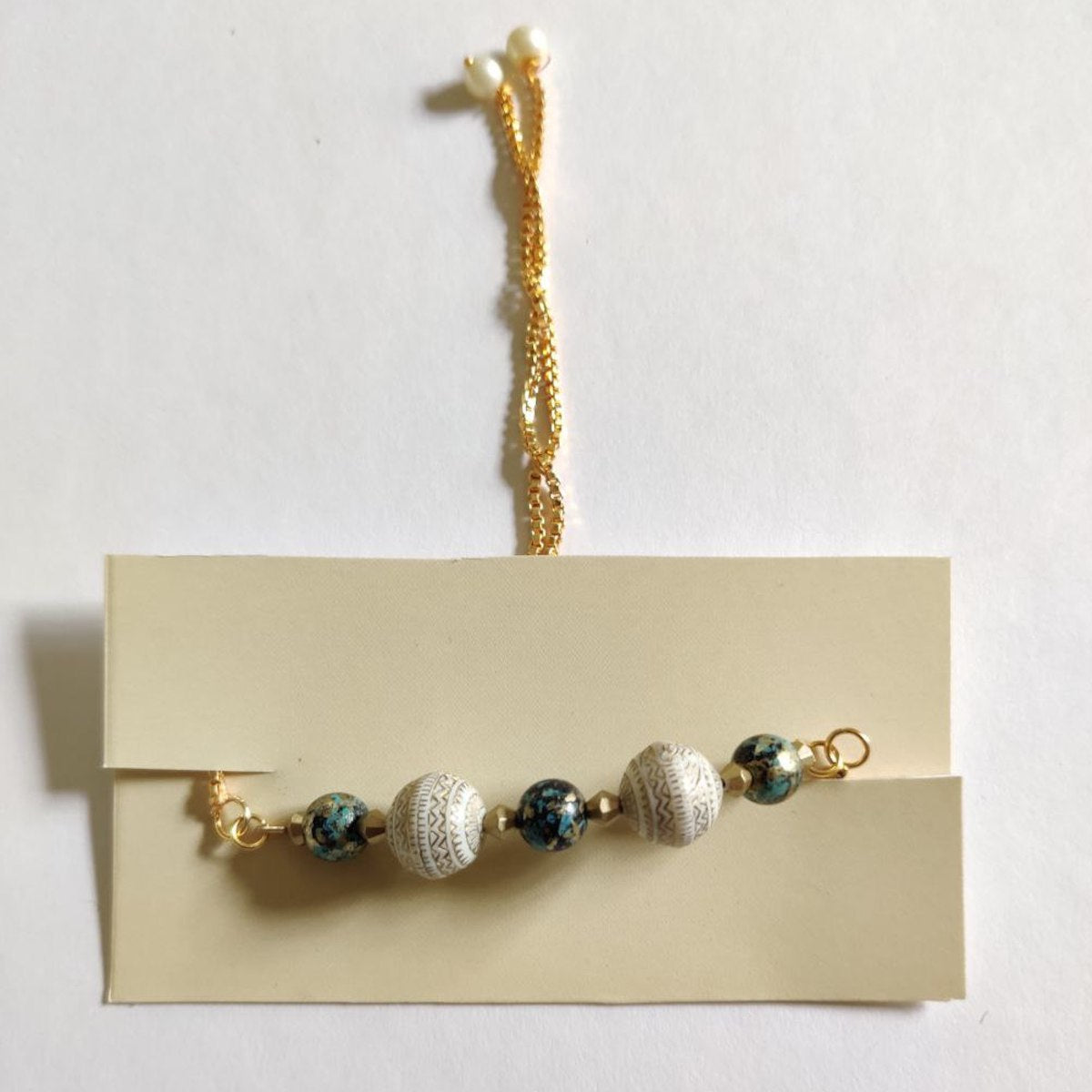 Teal-ivory beaded bracelet (A)